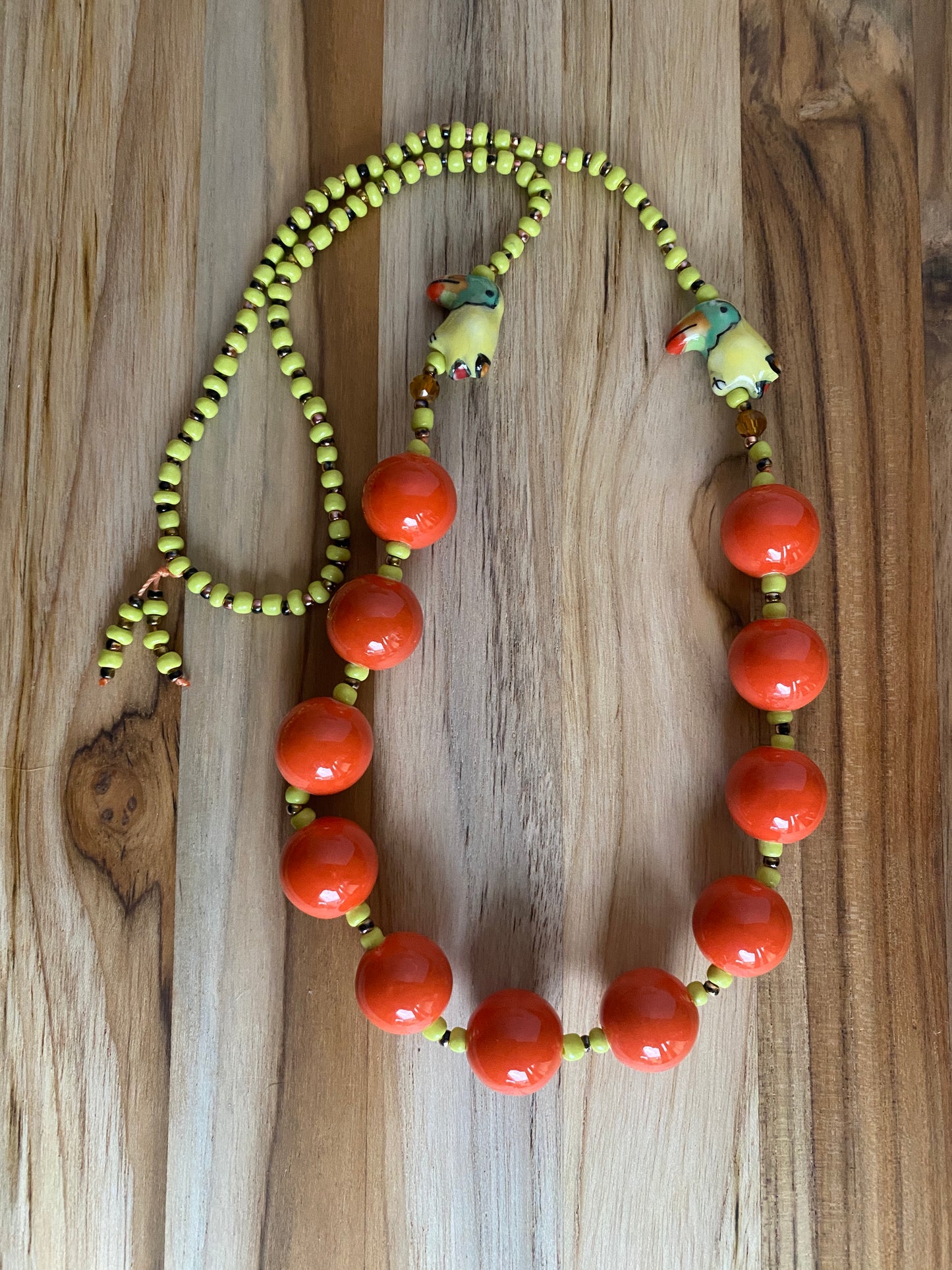 28" Long Orange Ceramic Beaded Necklace with Parrot Beads
