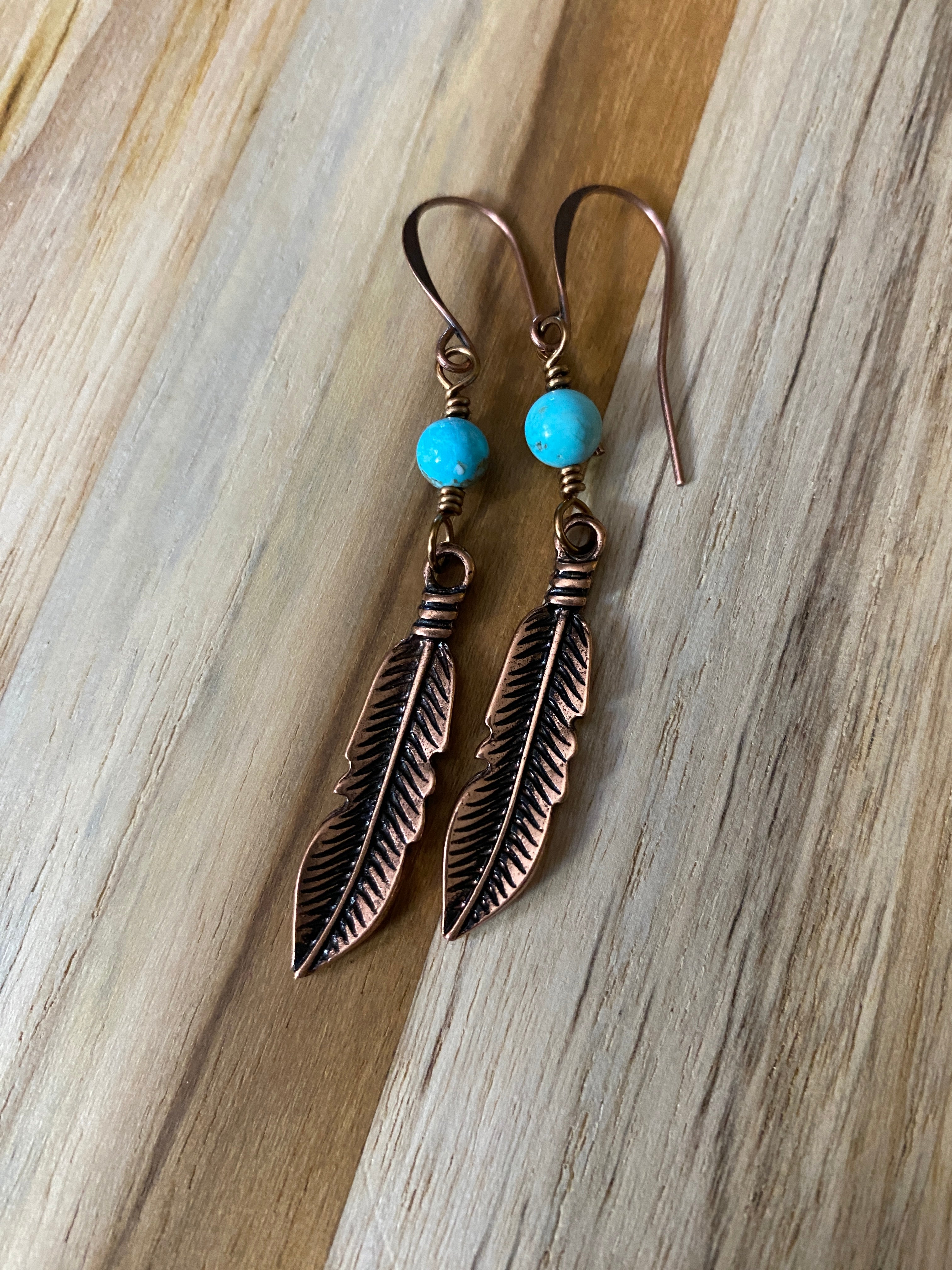 Feather on sale dangle earrings